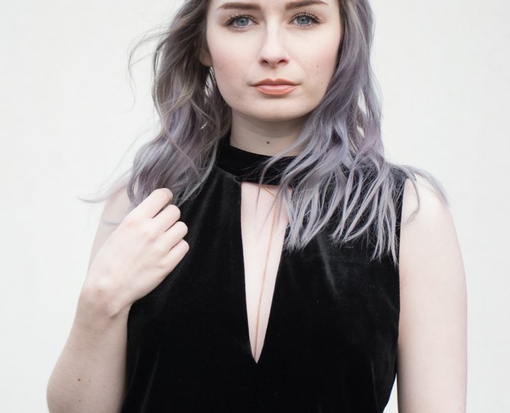 girl wearing black velvet playsuit