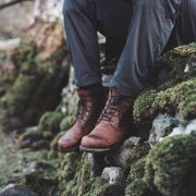 hiking boots on stone wall in the isle of skye