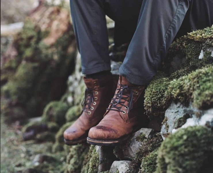 hiking boots on stone wall in the isle of skye