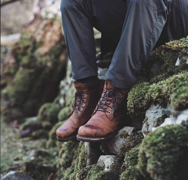 hiking boots on stone wall in the isle of skye