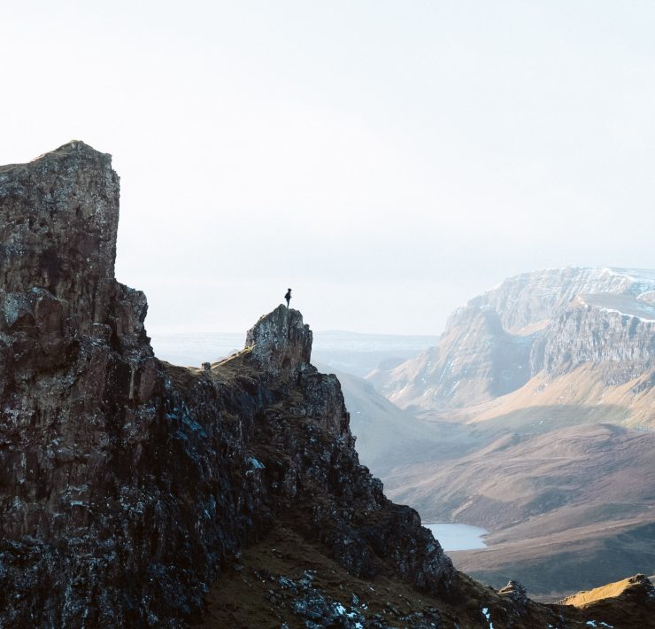 man standing on point at quiraing isle of skye | top 5 rural uk breaks