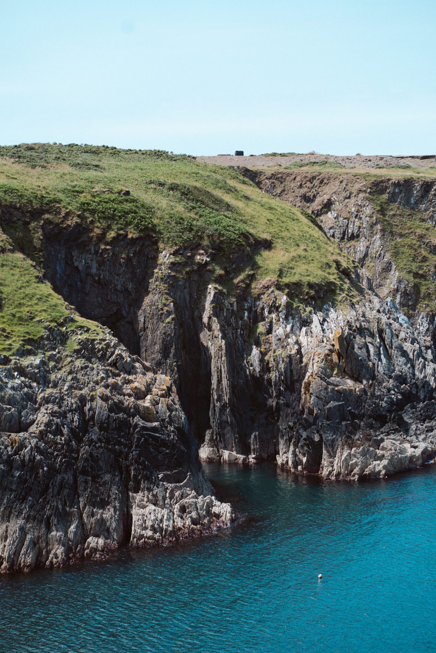 view of cliffs near porthgain village from the pembrokeshire coastal path