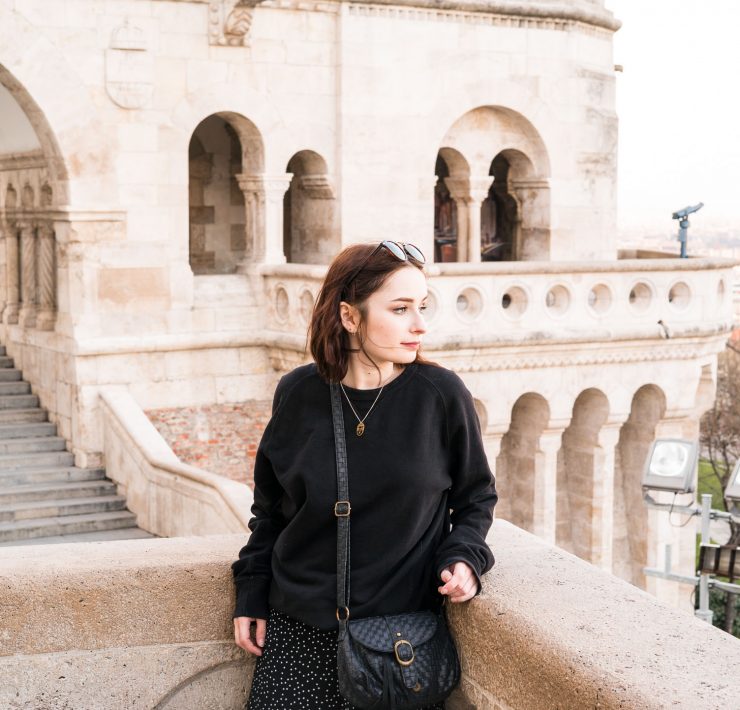 girl stood at the fishermans bastion in budapest. what to wear on a city break